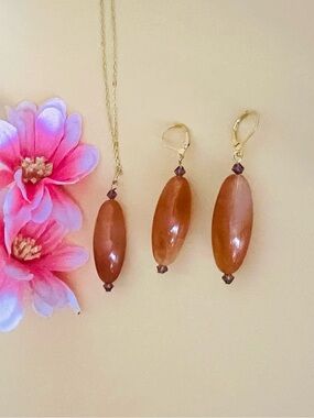 Gold plated long brown earrings set with crystal accents